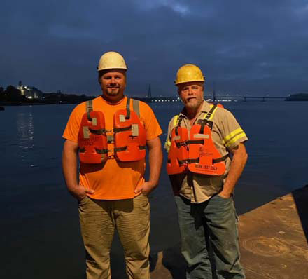 two rescuers pose